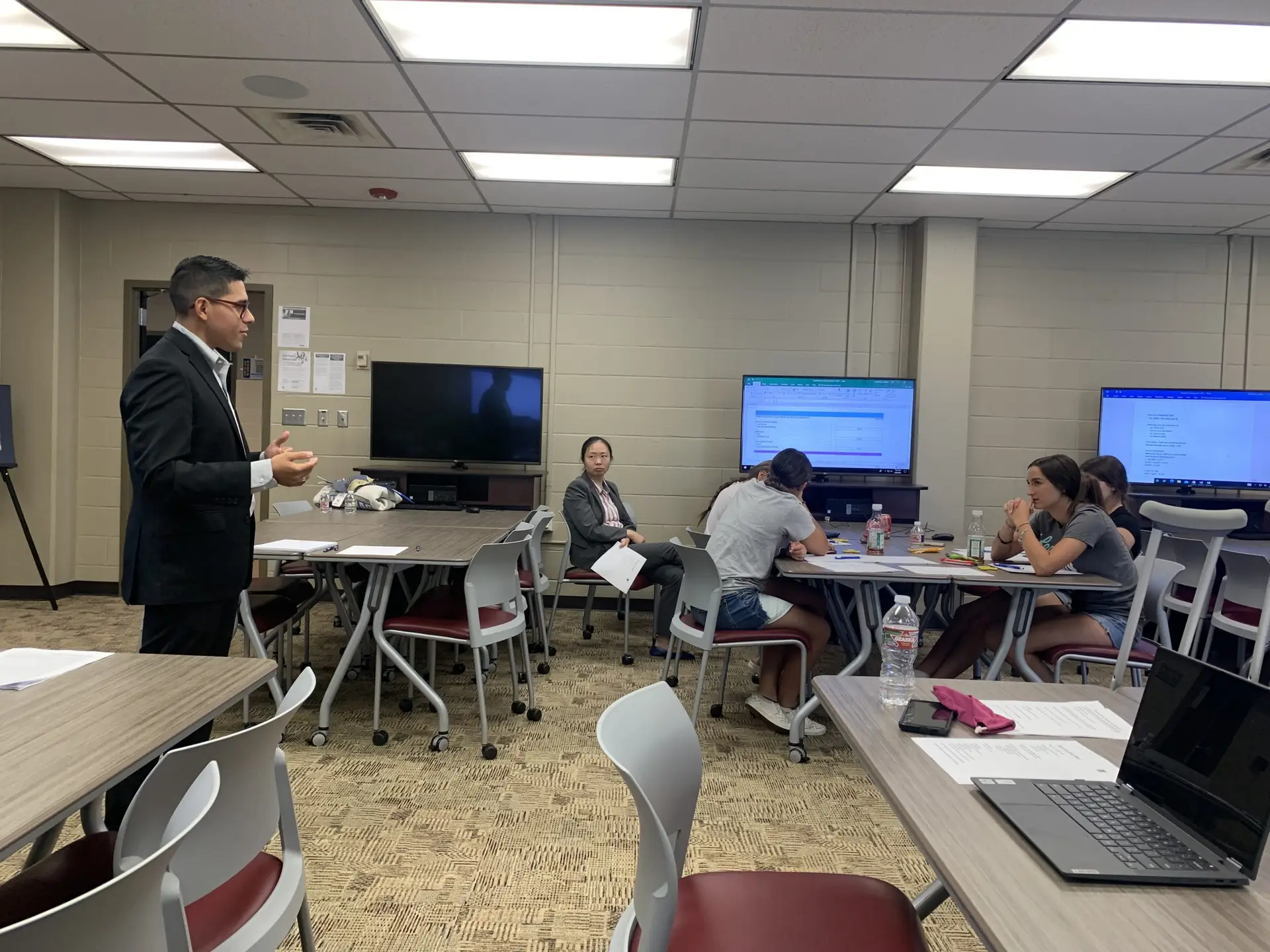 We Can Change IT educator training session with hands-on technology instruction in a classroom environment.